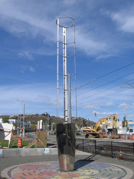 What appears to be wind-driven public artwork near Celsius and the trolley station generates electricity.