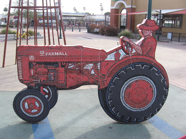 Both sides of this fun public art tractor are composed of small tiles.