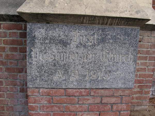 Plaque on building indicates the First Presbyterian Church was erected in 1913.