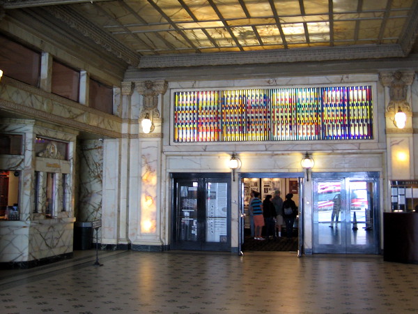 A tour group has entered the Spreckels Theatre from the Grand Lobby of the Spreckels Theater Building in downtown San Diego.