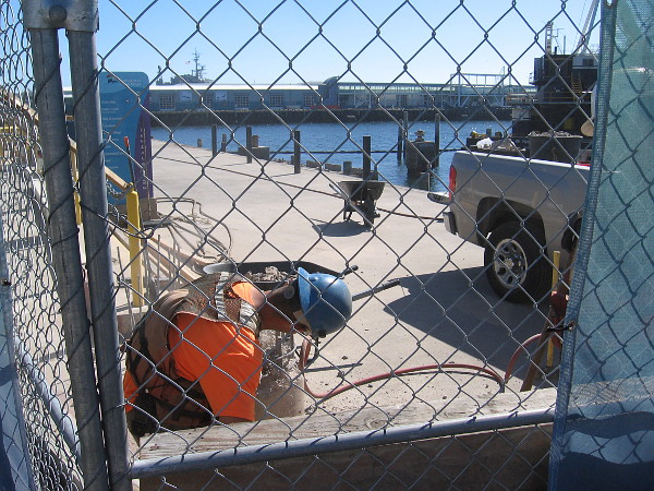 Several construction workers were making ready for a new project. The Portside Pier will include a Brigantine restaurant, various smaller eateries and a public observation deck.