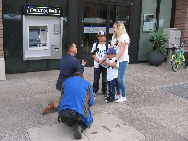 A family of Padres fans is interviewed at the Opening Weekend Block Party.
