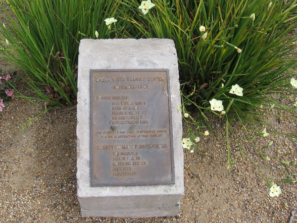 A small plaque among some flowers. Chula Vista Transit Center. November 1981.