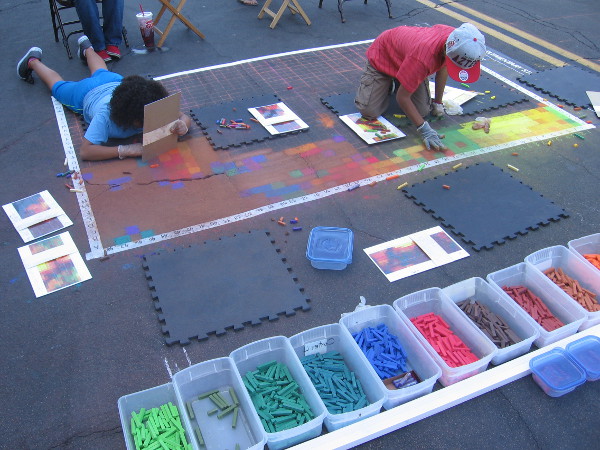Washington Elementary students create abstract Mona Lisa chalk art during 2014 Festa in Little Italy. It would later become the basis for some cool public art!