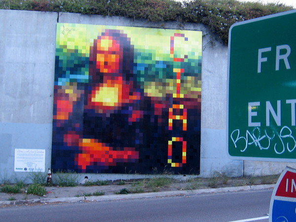 An abstract Mona Lisa mural greets cars with a large CIAO as drivers head onto southbound I-5 from Grape Street!