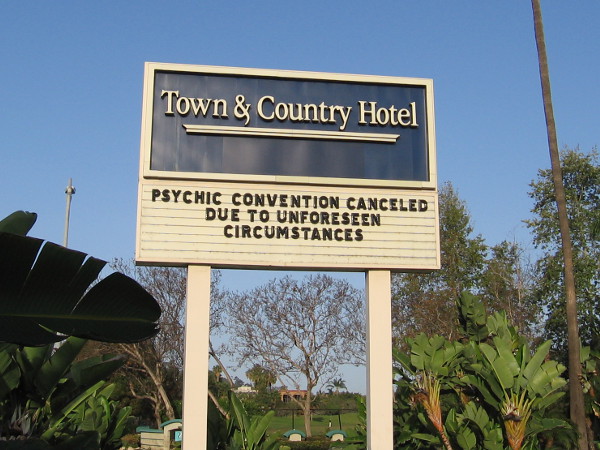 A funny sign at the Town and Country Hotel. Psychic convention canceled due to unforeseen circumstances.