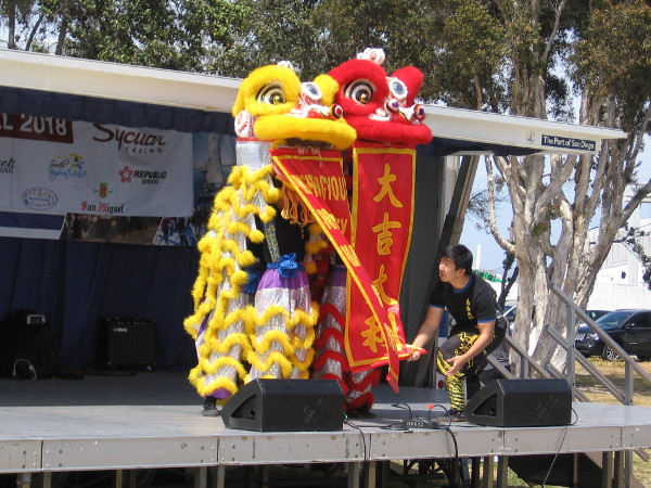 Banners unfurl, wishing everyone a happy and prosperous year.