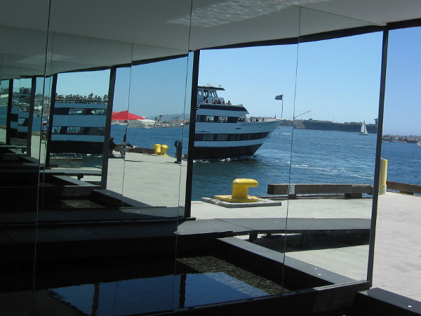 A harbor tour boat heading out onto the bay is transformed into strange fragments.