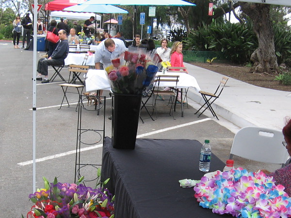 Later in the day, the Flower Fest was underway. Neighbors relax and enjoy a fun community event.