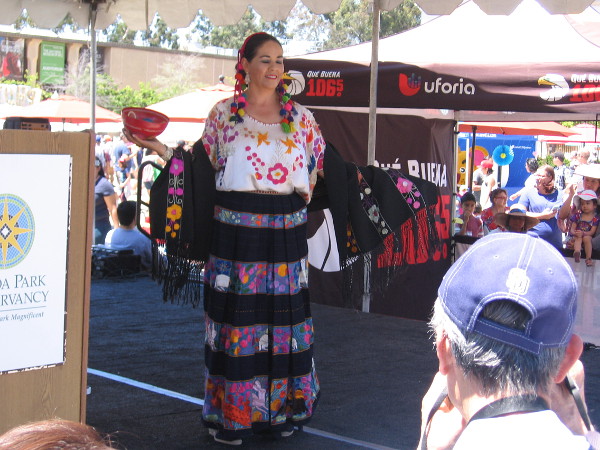 Dress from the Mexican state of Guerrero, if my notes are correct. Images in the fabric include flowers and jaguars.