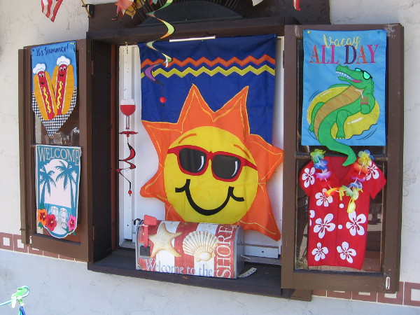 A sun smiles at Alamo Flags.