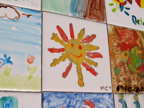 A smiling sun on one of the tile benches along the Embarcadero.