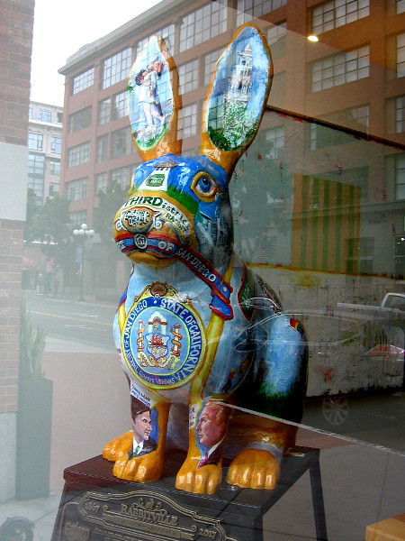A colorful Rabbitville bunny inside a window of the Hilton Gaslamp.