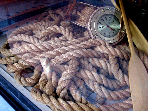 A tangle of rope inside the window of Crab Hut on Broadway.