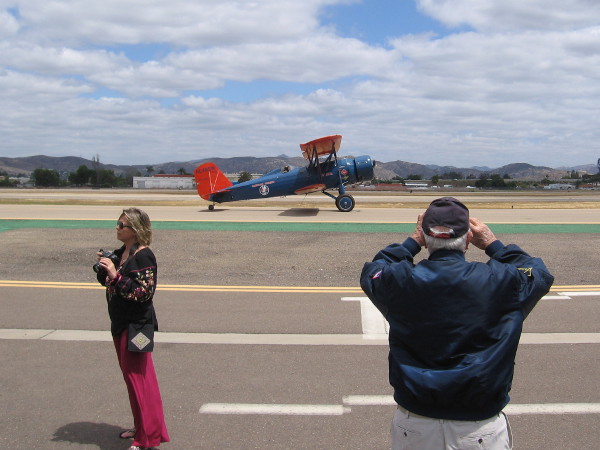 It slowly heads down the runway to prepare for takeoff.