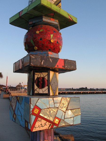 Closer photo of late sunlight on A Different But Loving Pair, by artist Cecilia Stanford, 2005. Originally exhibited during Urban Trees 2.