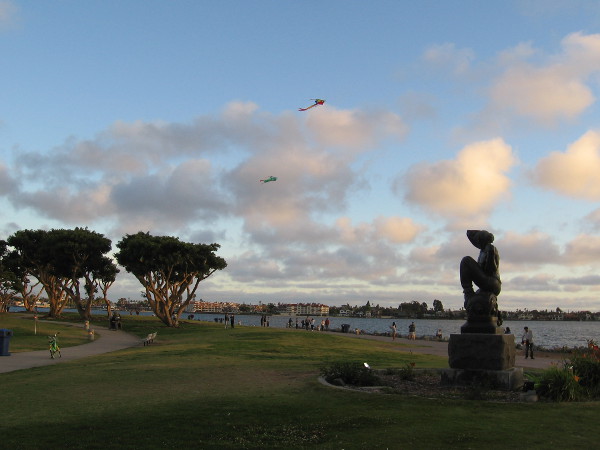 Kites fly above Donal Hord's sculpture Morning.