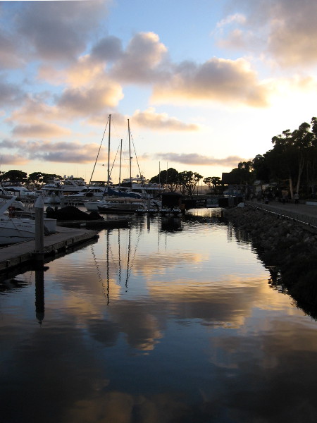 Sunset clouds reflected in the still water of Marriott Marina.