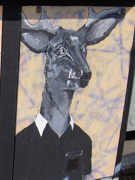 A deer dressed in a polo shirt. Humorous street art in Golden Hill.
