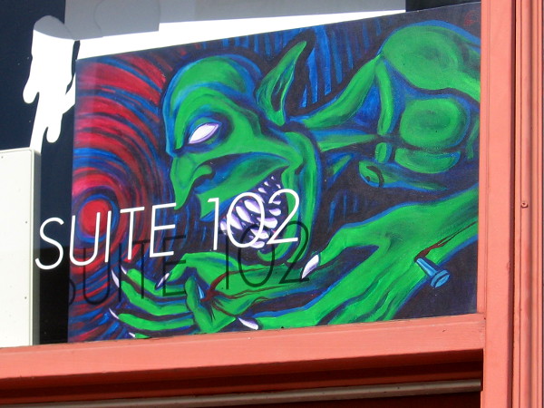 A green fiendish creature awaits those who might venture into Suite 102.