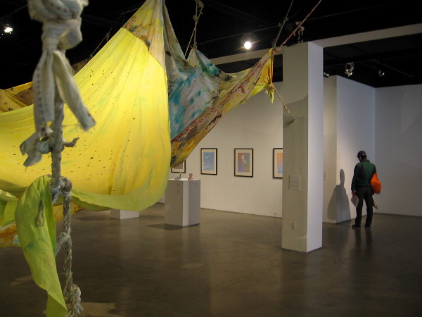 Visitor to the San Diego Art Institute in Balboa Park absorbs the exhibition of High-Key: Color in Southern California.
