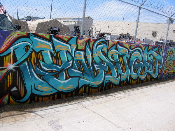Another section of colorful graffiti.