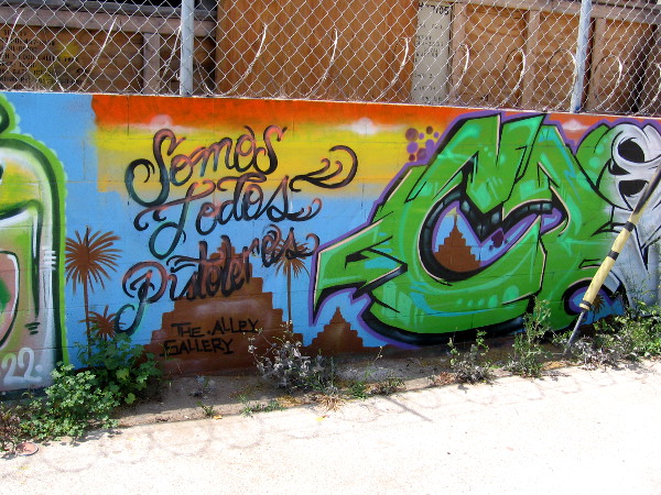 Somos Todos Pistoleros above a pyramid in the Alley Gallery.