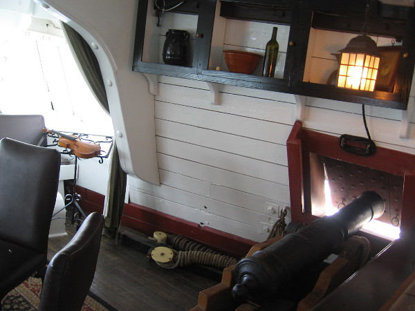 Historically, guns were deployed in the great cabin during battles at sea. To make room, furniture was removed and placed in a longboat which was then towed behind the ship!