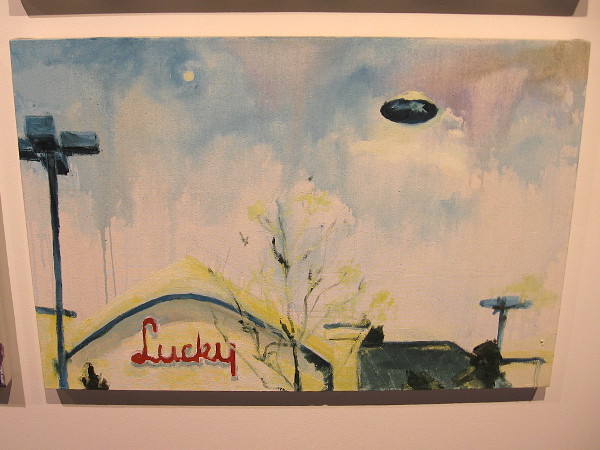 A flying saucer above a Lucky supermarket! Artist Matthew Bradley has fun with the popular imagination in the Space Age.
