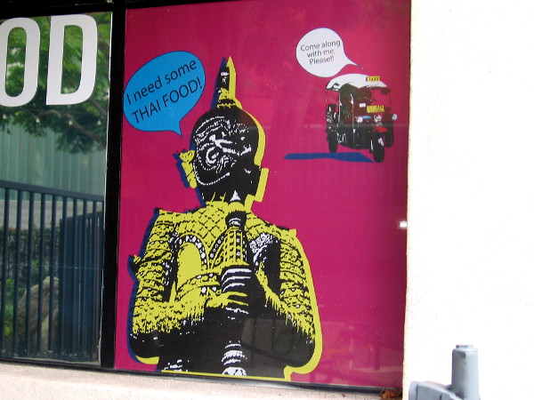 All sorts of amusing graphics decorate the windows of the restaurant AAHARN by Koon Thai.