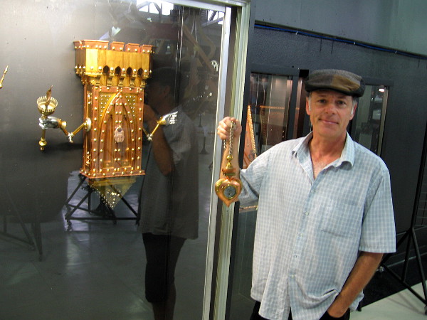 Jeff Steorts poses for a photo. Some of his created objects are clocks or resemble them. He explores many themes including Time and Space.