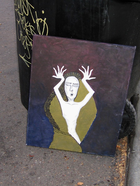 I spied this small work of art leaning up against a garbage can downtown.