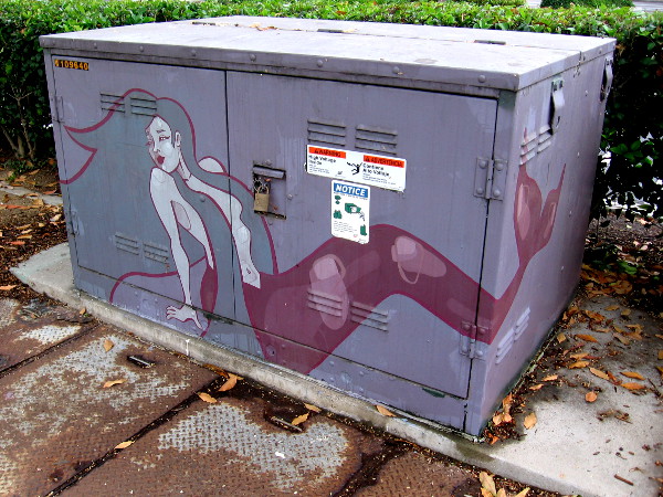 Another nearby transformer has been painted with a mermaid.