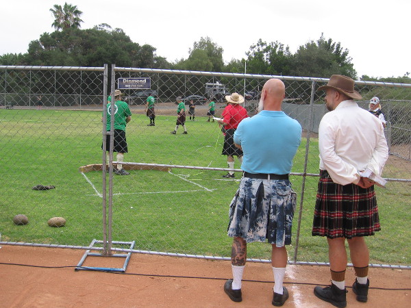 Strong athletes compete on the Brengle Terrace Park's baseball field. The Scottish Heavy Athletics include Weight Toss, Weight Throw, Hammer Throw, Braemar Stone and Caber Toss
