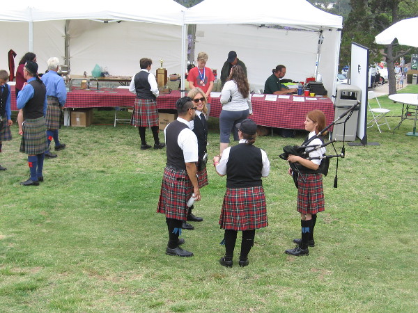Different age groups compete in solo piping, drumming, and drum major for trophies.