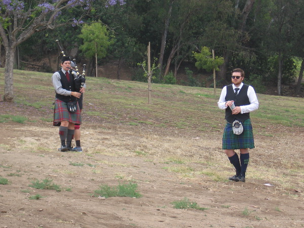 Someone stands in the distance practicing bagpipes. The distinctive sound could be heard all around the park!