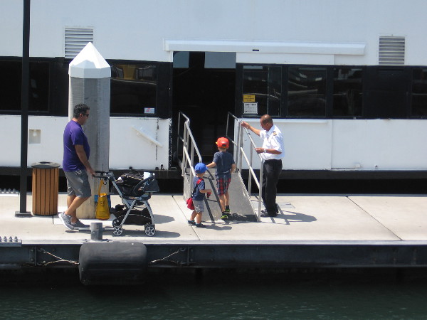 Family boards the Coronado Ferry near Broadway Pier.