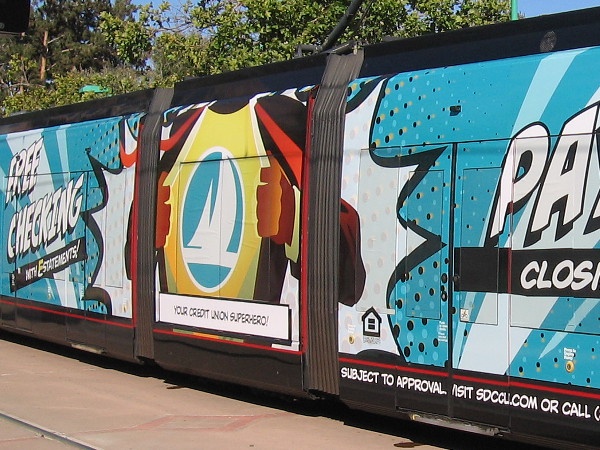 A trolley wrap during Comic-Con advertises SDCCU, Your Credit Union Superhero!