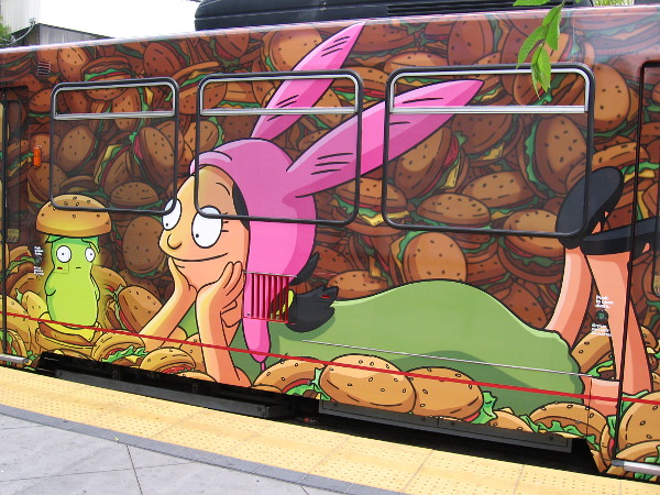 Louise Belcher and Kuchi Kopi on a San Diego Comic-Con trolley wrap.