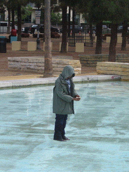 A creepy child mannequin now stands in the Children's Park fountain, with a cage looming among the trees behind him. Part of the Castle Rock offsite.