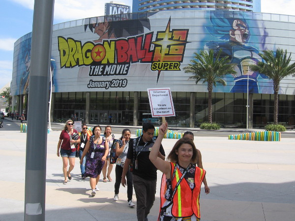 A line of Comic-Con volunteers passes by the afternoon of Preview Night.