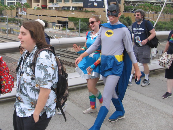 Batman grins. I'm not sure about the cosplay next to him.