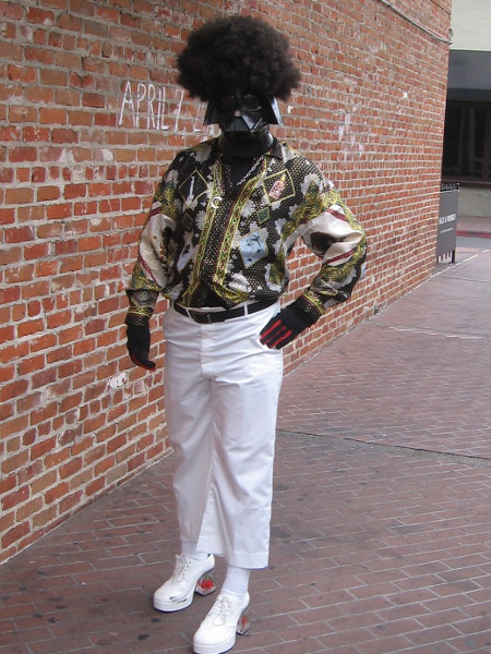 A disco Darth Vader with flashy clothes and an Afro.