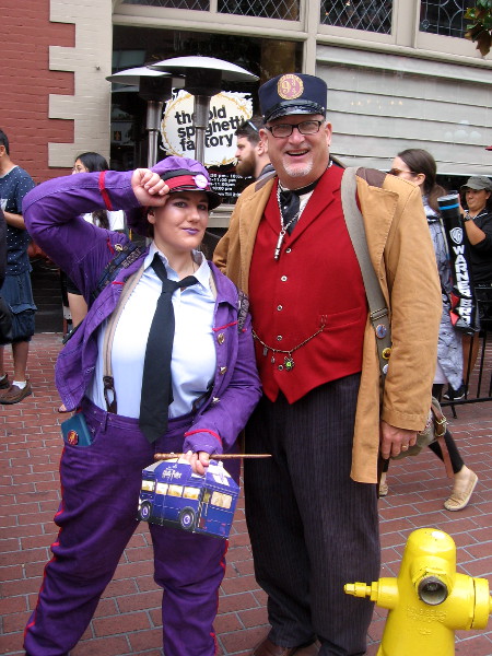 Knight Bus conductor and Hogwarts Express conductor cosplay.