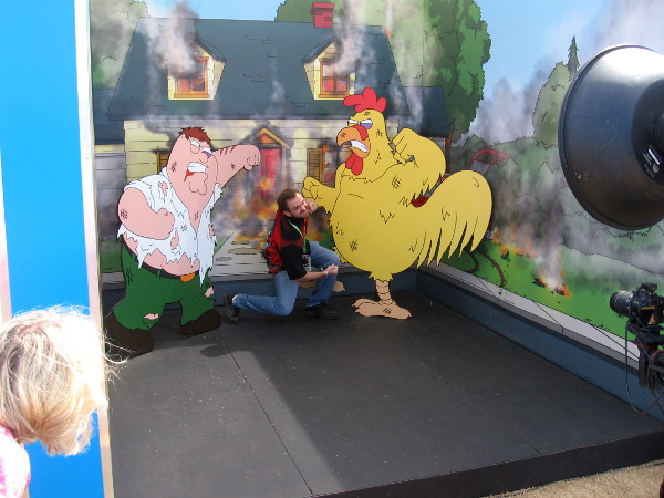 Some poor guy is caught between a fight between Peter Griffin and Ernie the Giant Chicken.