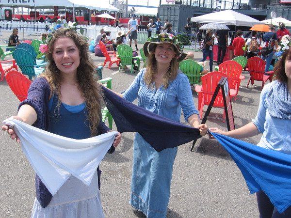 Shortly after I arrive, three lovely, sweet, irresistible ladies with Sacred Lies prepare to encircle me with their scarfs.