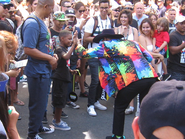 The Syfy band played the theme from Ghostbusters. A kid wearing a Ghostbusters t-shirt receives a medal and a high five!