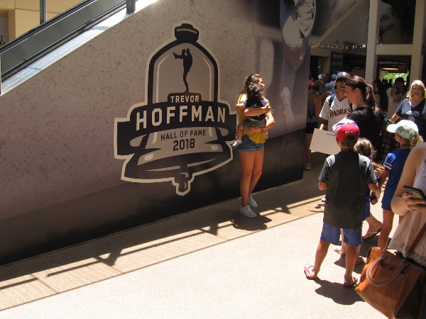Fans were posing by some new Trevor Hoffman Hall of Fame graphics on a wall along the Petco Park concourse.