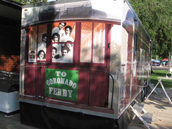 Graphic on restroom trailer shows the faces peering from a streetcar that ran along Orange Avenue to the original ferry landing.