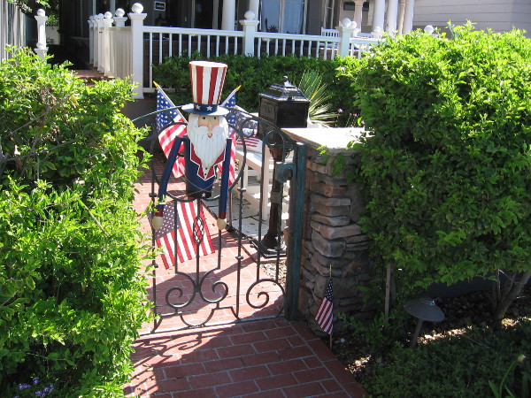 A smiling Uncle Sam at someone's front gate.
